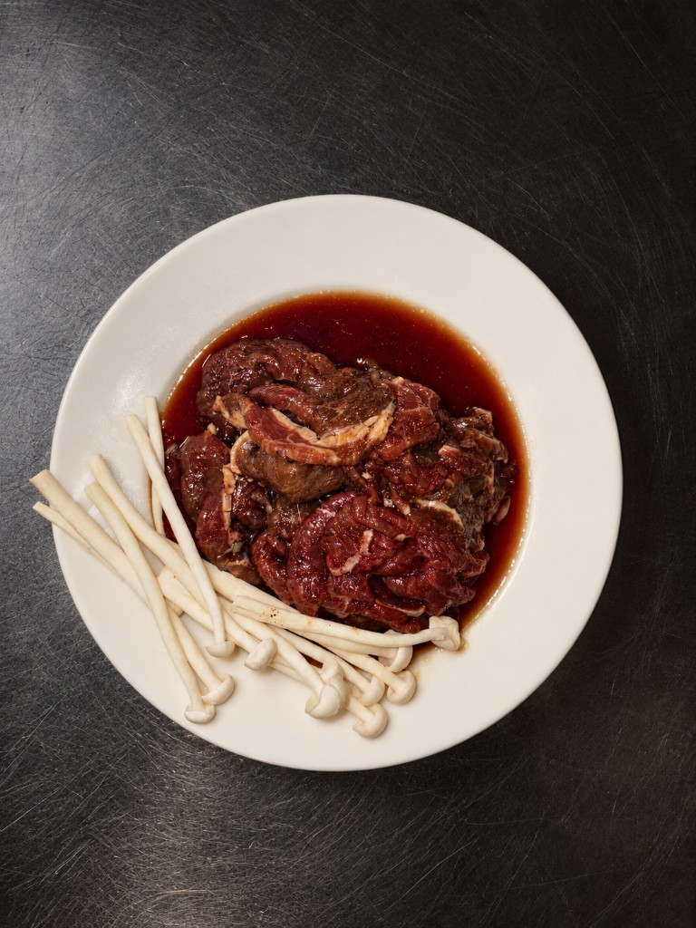 Bulgogi — marinated beef with enoki mushrooms
